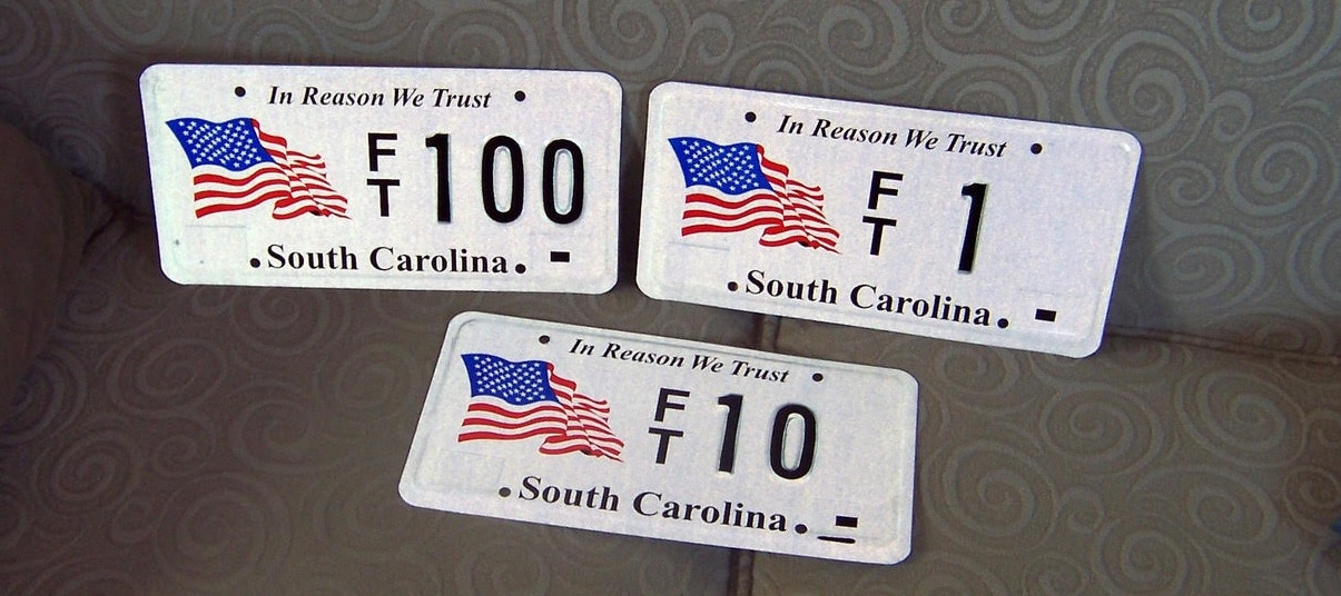 Photo of 3 "In Reason We Trust" license plates