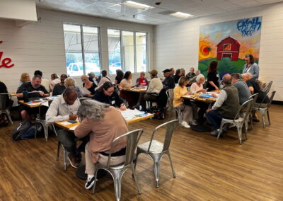 Photo of SHL members filling out postcards